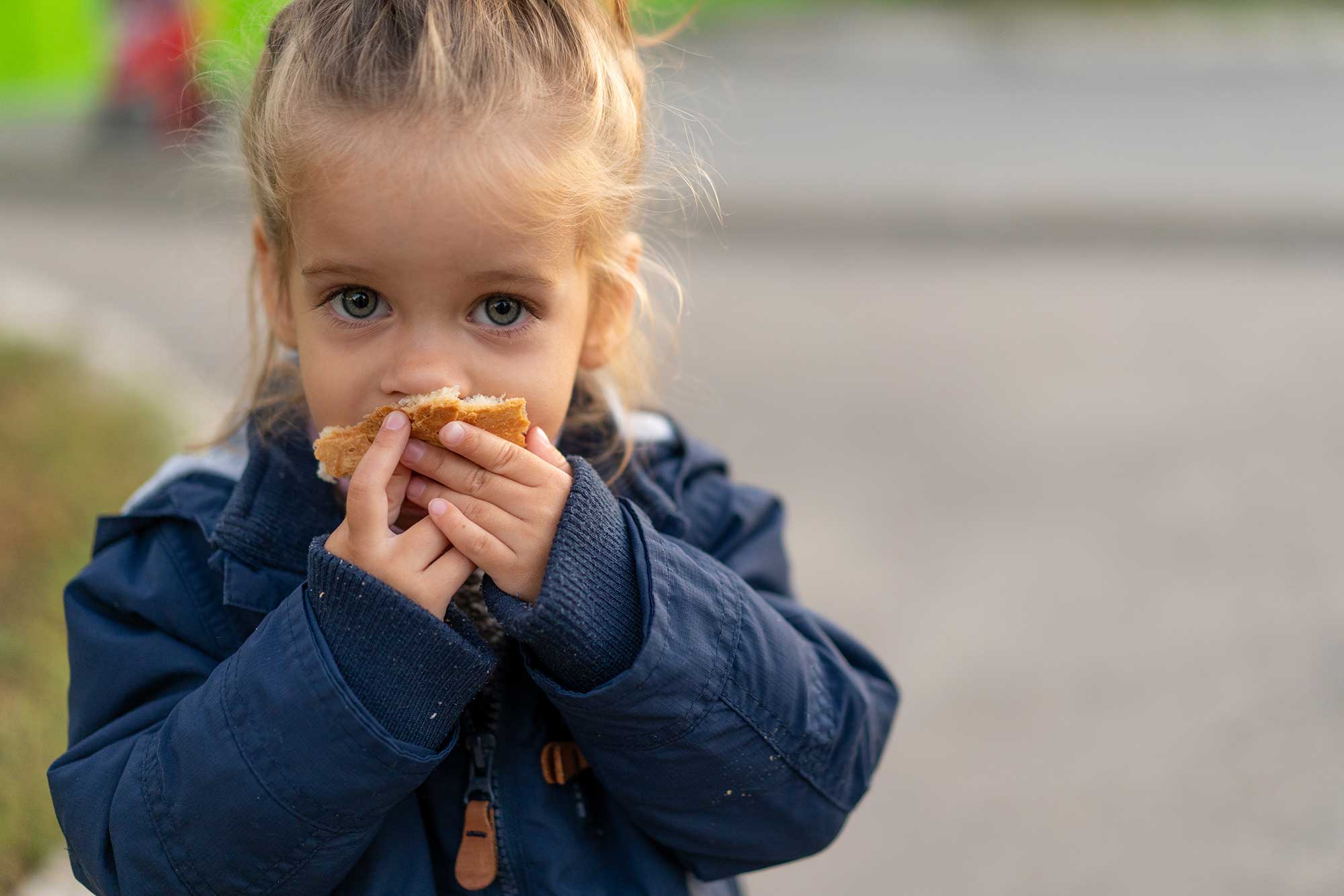 A girl eats a snack